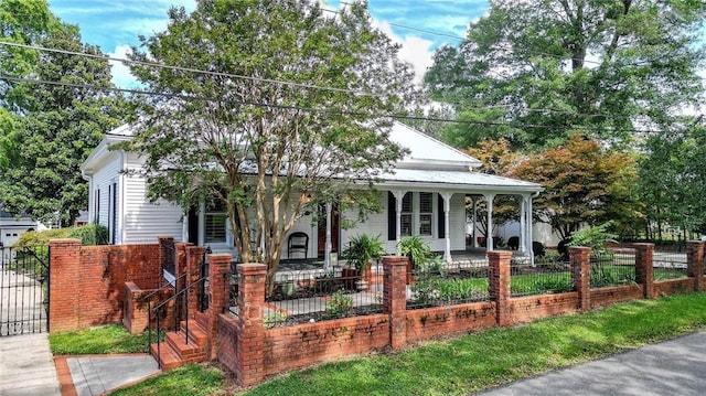 farmhouse-style home featuring covered porch