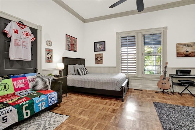 bedroom with ceiling fan, parquet flooring, and ornamental molding