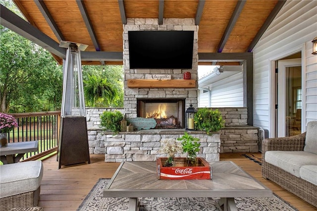 exterior space with an outdoor stone fireplace