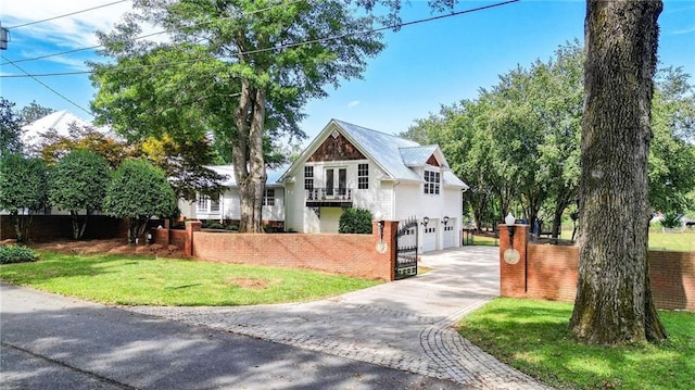 view of front of house with a front lawn and a garage