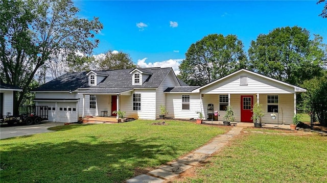 view of front of property with a porch, a garage, and a front yard