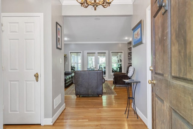 2190 Stephen Long Dr NE, Atlanta, GA 30305 - foyer featuring light wood-style floors, a chandelier, crown molding, baseboards, and recessed lighting