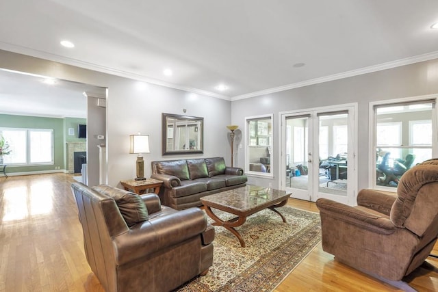 2190 Stephen Long Dr NE, Atlanta, GA 30305 - living room with light wood-type flooring, french doors, ornamental molding, recessed lighting, and a fireplace