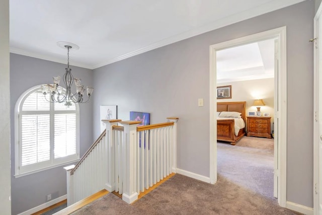 2190 Stephen Long Dr NE, Atlanta, GA 30305 - hall with carpet flooring, a chandelier, an upstairs landing, baseboards, and crown molding