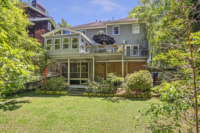 2190 Stephen Long Dr NE, Atlanta, GA 30305 - rear view of house with a sunroom, a yard, and a deck