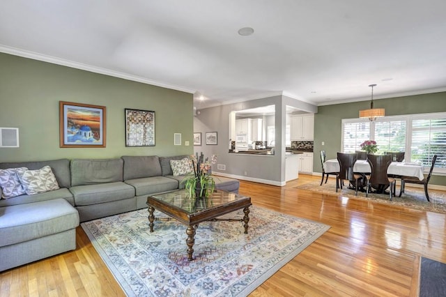 2190 Stephen Long Dr NE, Atlanta, GA 30305 - living room with light wood-style floors, crown molding, and baseboards