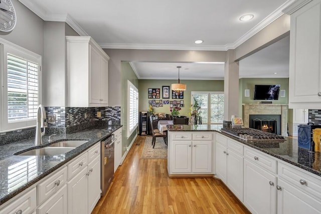 2190 Stephen Long Dr NE, Atlanta, GA 30305 - kitchen featuring a sink, light wood-type flooring, healthy amount of natural light, stainless steel dishwasher, and recessed lighting