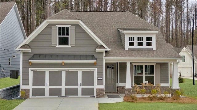 475 Azalea Xing, Dallas, GA 30132 - craftsman-style house featuring concrete driveway, a standing seam roof, stone siding, and a garage