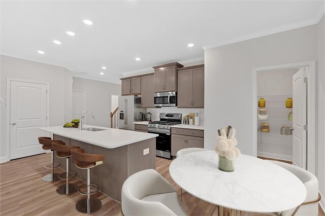 475 Azalea Xing, Dallas, GA 30132 - kitchen featuring a kitchen island with sink, a sink, recessed lighting, and stainless steel appliances
