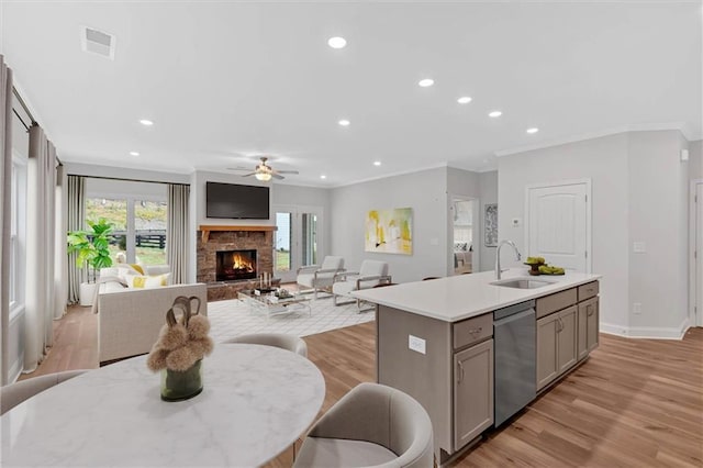 475 Azalea Xing, Dallas, GA 30132 - kitchen with crown molding, stainless steel dishwasher, visible vents, a sink, and a center island with sink