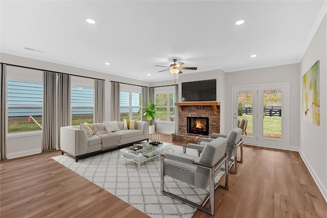 475 Azalea Xing, Dallas, GA 30132 - living room with light wood-style floors, a wealth of natural light, a ceiling fan, and baseboards