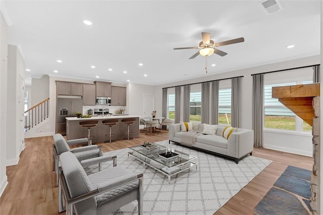 475 Azalea Xing, Dallas, GA 30132 - living area featuring ceiling fan, baseboards, ornamental molding, and plenty of natural light