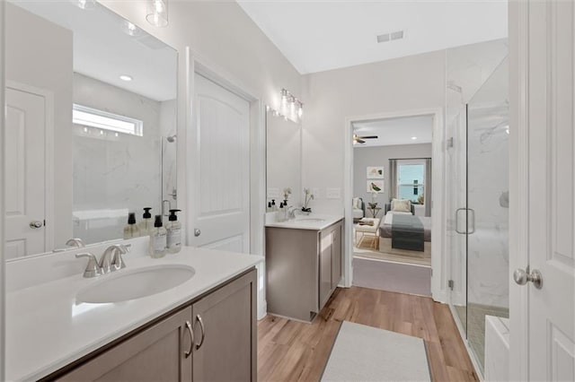 475 Azalea Xing, Dallas, GA 30132 - bathroom with wood finished floors, a marble finish shower, a sink, and visible vents