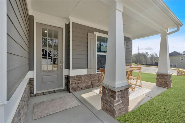 475 Azalea Xing, Dallas, GA 30132 - property entrance featuring a porch, a yard, and stone siding