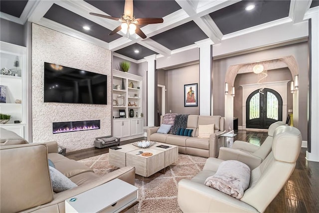 850 Cog Hl, Mcdonough, GA 30253 - living room with arched walkways, built in features, decorative columns, wood finished floors, and coffered ceiling