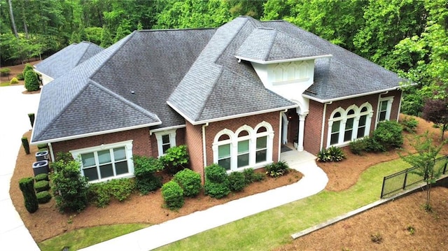 850 Cog Hl, Mcdonough, GA 30253 - back of house with a lawn, a shingled roof, cooling unit, and brick siding