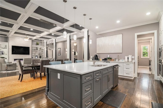 850 Cog Hl, Mcdonough, GA 30253 - kitchen with stainless steel dishwasher, open floor plan, dark wood-style floors, a sink, and gray cabinetry