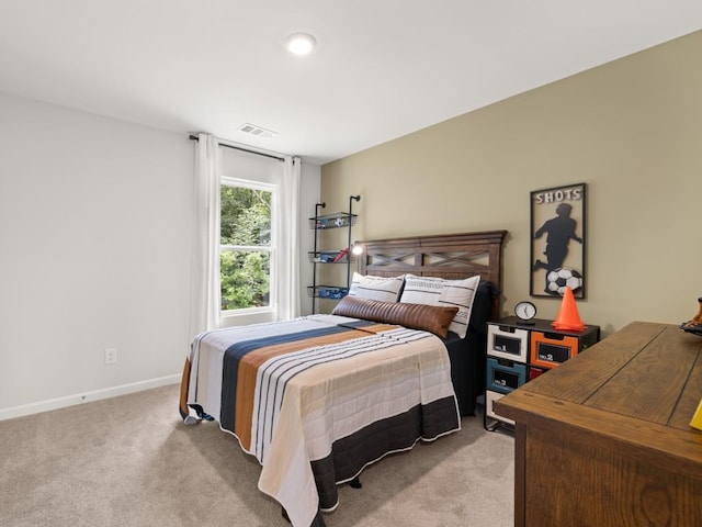 bedroom featuring light carpet, baseboards, and visible vents