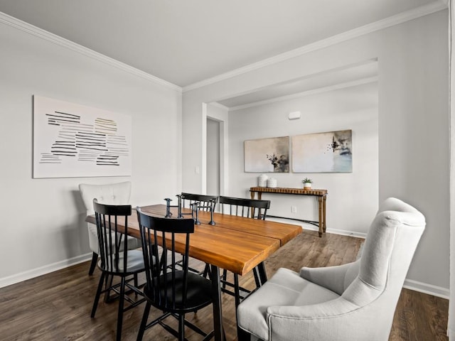 dining space with dark wood-style floors, crown molding, and baseboards