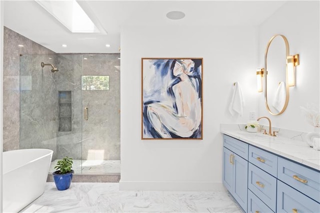 bathroom with a freestanding tub, vanity, a stall shower, and marble finish floor