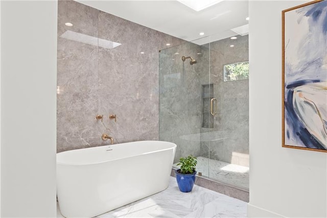full bathroom featuring recessed lighting, a freestanding bath, marble finish floor, and a stall shower