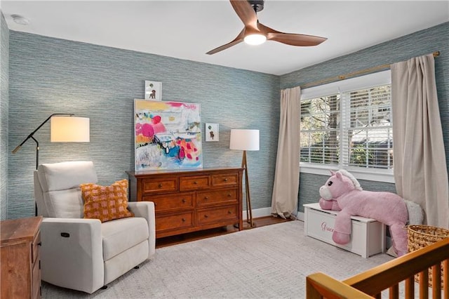 bedroom featuring ceiling fan and baseboards