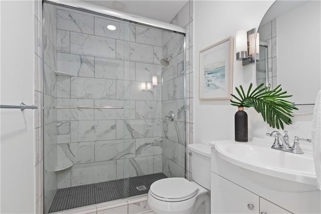 full bath featuring vanity, toilet, and a stall shower
