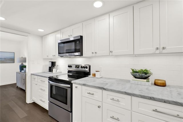 12 Ivy Rdg NE, Atlanta, GA 30342 - kitchen featuring stainless steel appliances, dark wood finished floors, white cabinetry, recessed lighting, and light stone counters