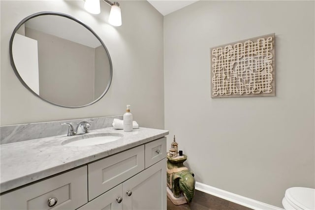 12 Ivy Rdg NE, Atlanta, GA 30342 - half bathroom featuring vanity and wood finished floors