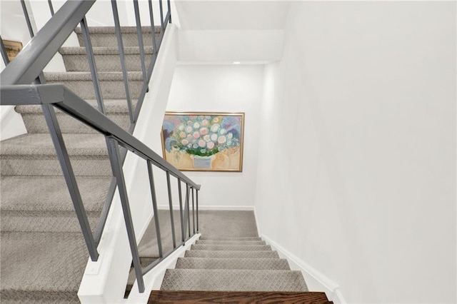 12 Ivy Rdg NE, Atlanta, GA 30342 - stairway with baseboards and carpet flooring