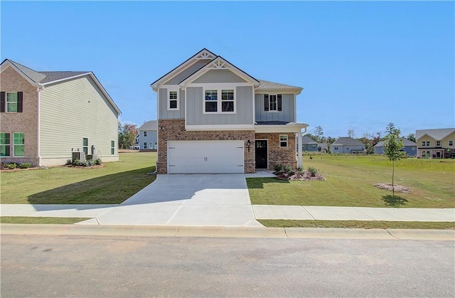 view of front facade with a garage, cooling unit, and a front lawn