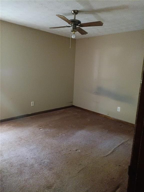 unfurnished room featuring carpet floors and ceiling fan