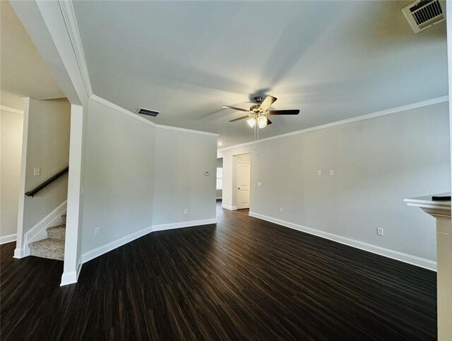 unfurnished living room with visible vents, baseboards, ceiling fan, and dark wood finished floors