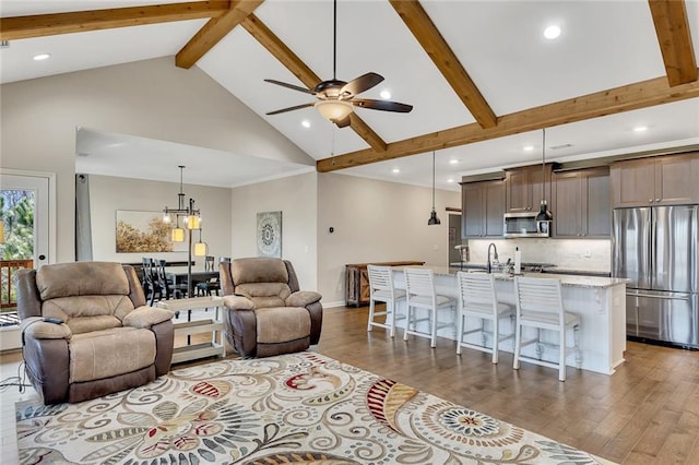 living room featuring beam ceiling, ceiling fan, high vaulted ceiling, and dark hardwood / wood-style floors