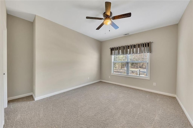 unfurnished room with carpet and ceiling fan