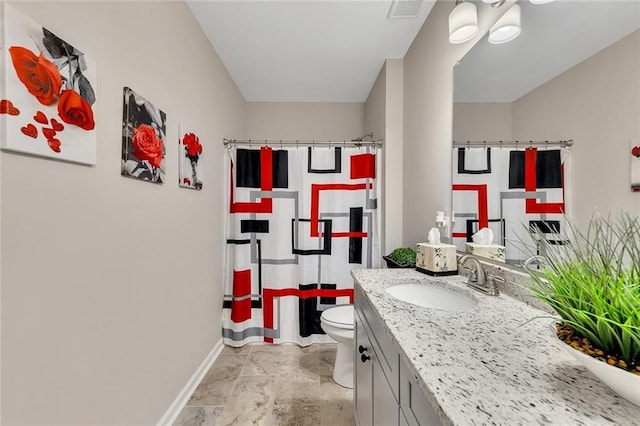 bathroom with curtained shower, vanity, and toilet