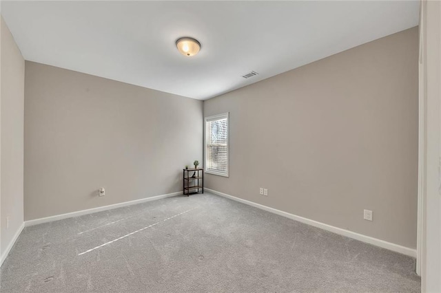 empty room featuring light colored carpet