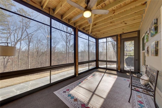 unfurnished sunroom with beam ceiling, ceiling fan, and wood ceiling