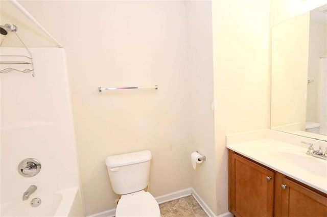 bathroom featuring  shower combination, vanity, toilet, and baseboards