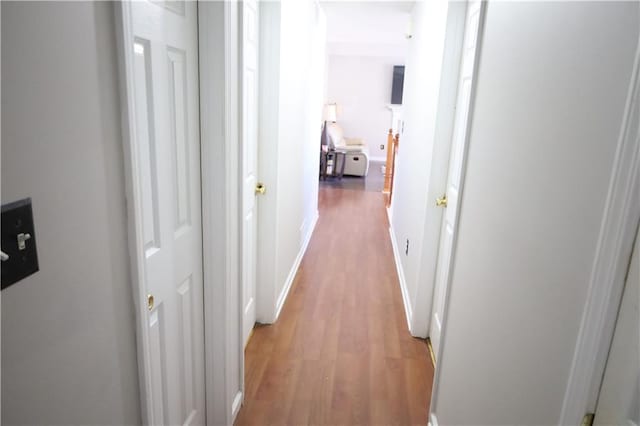 hall with light wood-type flooring