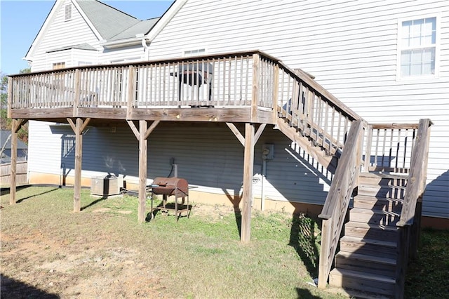 view of property exterior with a yard, a deck, and central air condition unit