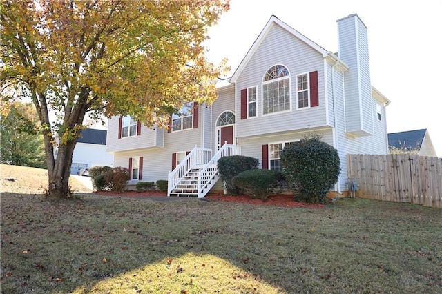 bi-level home with a front yard