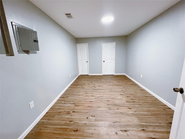 spare room featuring light hardwood / wood-style floors