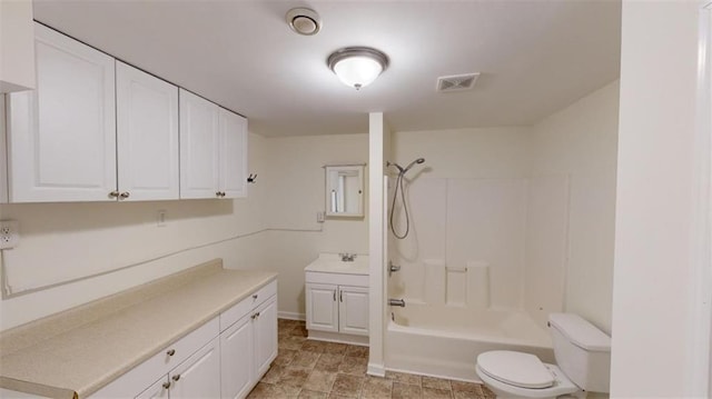 full bathroom with vanity, toilet, and washtub / shower combination