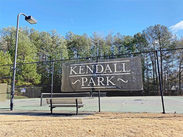 surrounding community featuring tennis court