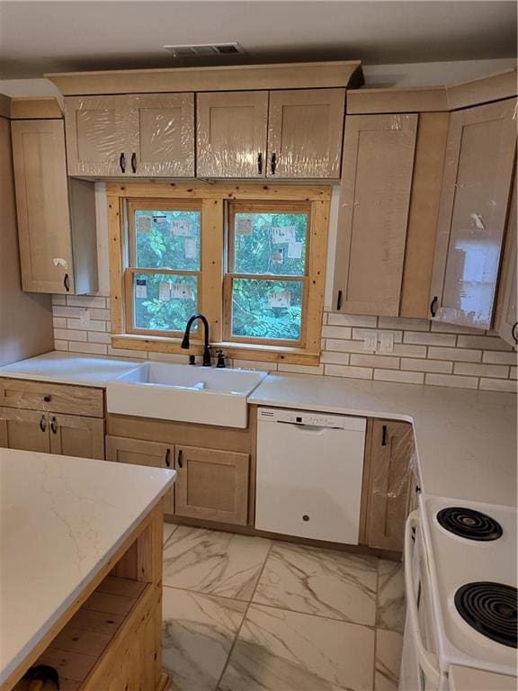 1167 Oakland Dr SW, Atlanta, GA 30310 - kitchen with white appliances, light marble finish floors, light countertops, and a sink