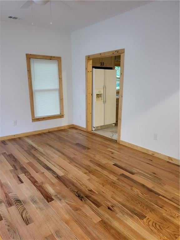 1167 Oakland Dr SW, Atlanta, GA 30310 - unfurnished room with light wood-type flooring, baseboards, and ceiling fan