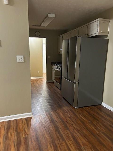 kitchen featuring appliances with stainless steel finishes and dark hardwood / wood-style floors