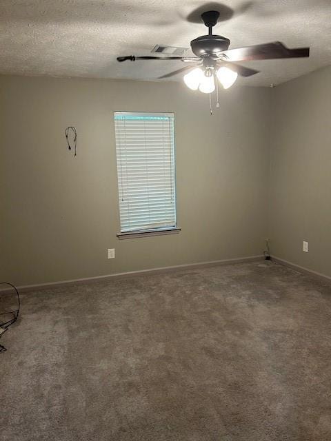 unfurnished room with carpet flooring, a textured ceiling, and ceiling fan