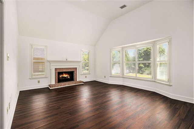 1484 Winston Pl, Decatur, GA 30033 - unfurnished living room with dark wood-type flooring, vaulted ceiling, visible vents, and baseboards